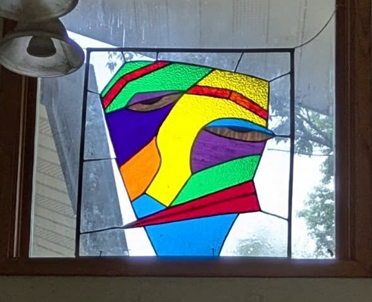 Self Reflection — stained glass panel in window